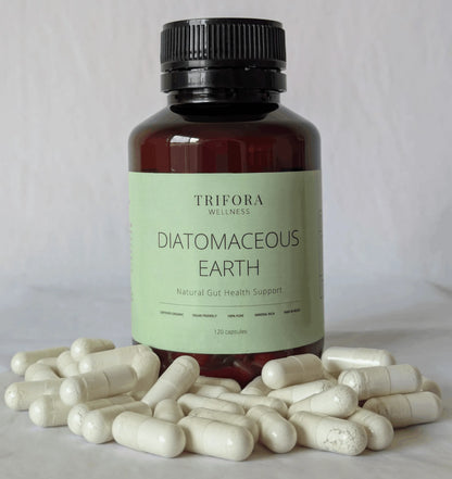 Bottle of Trifora Wellness Diatomaceous Earth supplement with capsules on a light background
