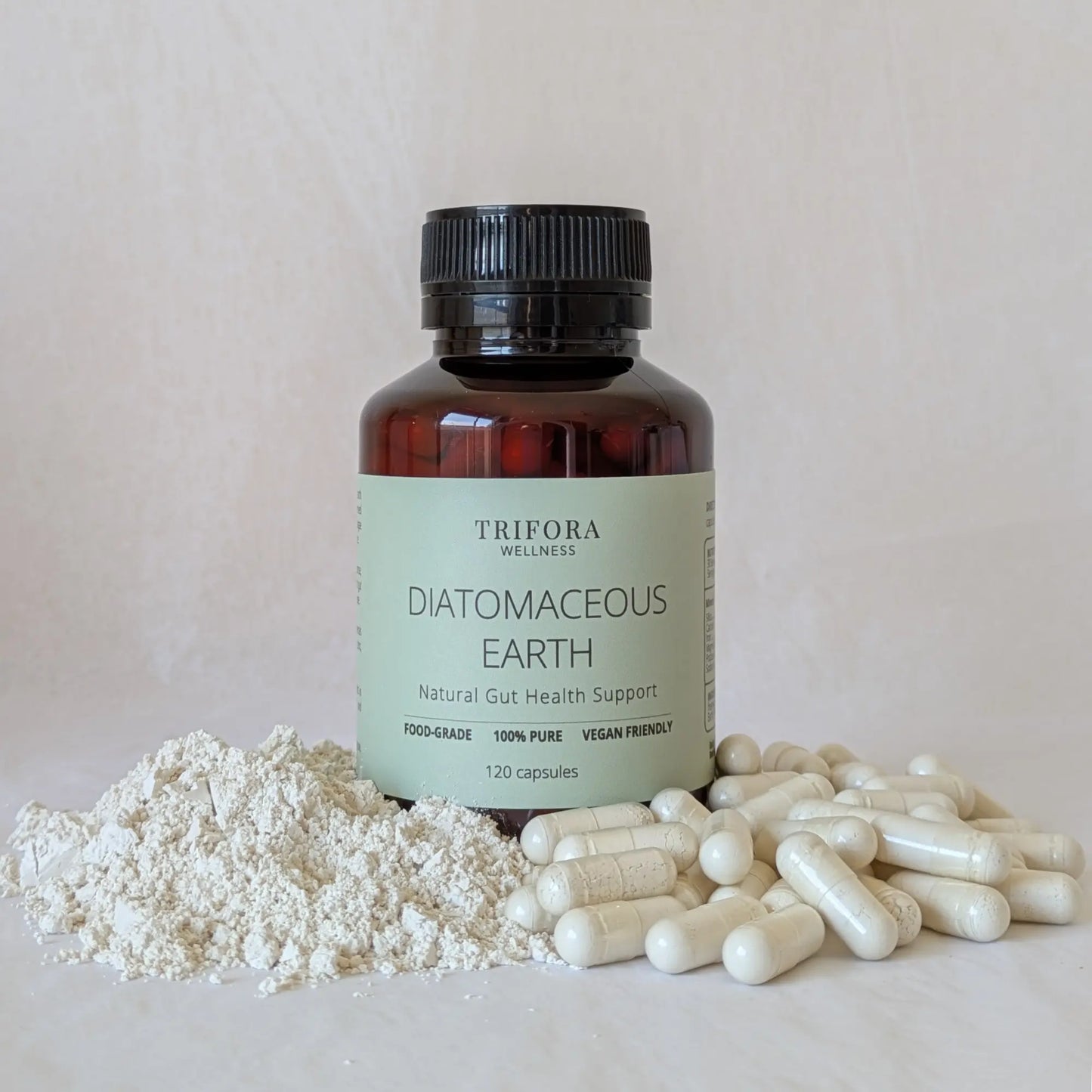 Bottle of Trifora Wellness Diatomaceous Earth with powder and capsules on a light background